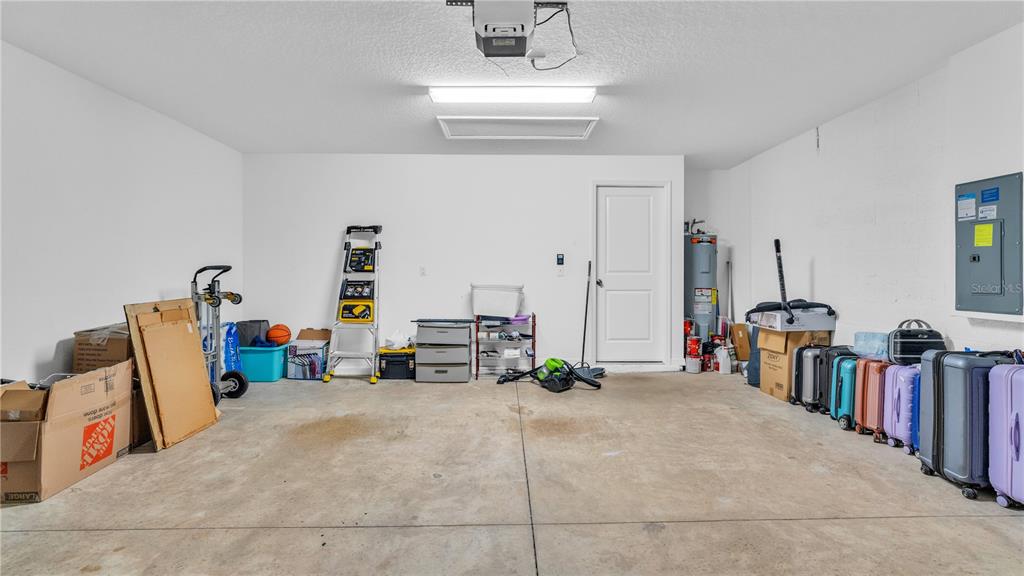 1841 Crinkle Leaf Court Ruskin, FL 33570 - Photo 34 of 35 a bedroom with furniture and a view of living room