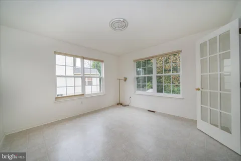 an empty room with windows