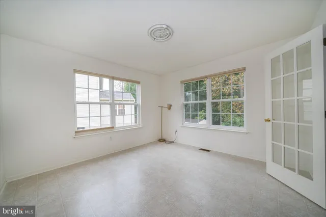 an empty room with windows