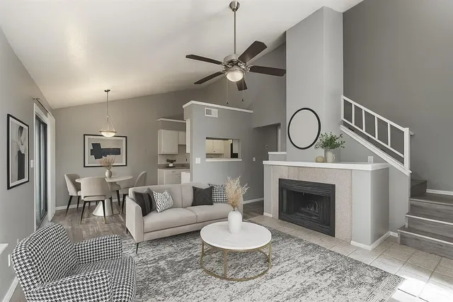 a living room with furniture and a fireplace