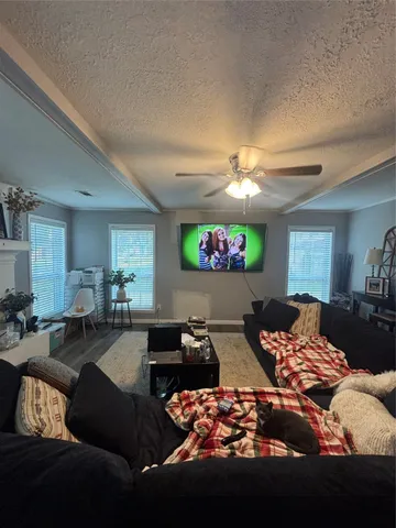 a bedroom with furniture and a chandelier