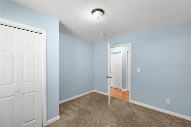 an empty room with closet area