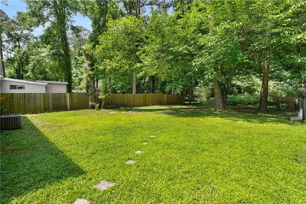 a view of a backyard with a small cabin