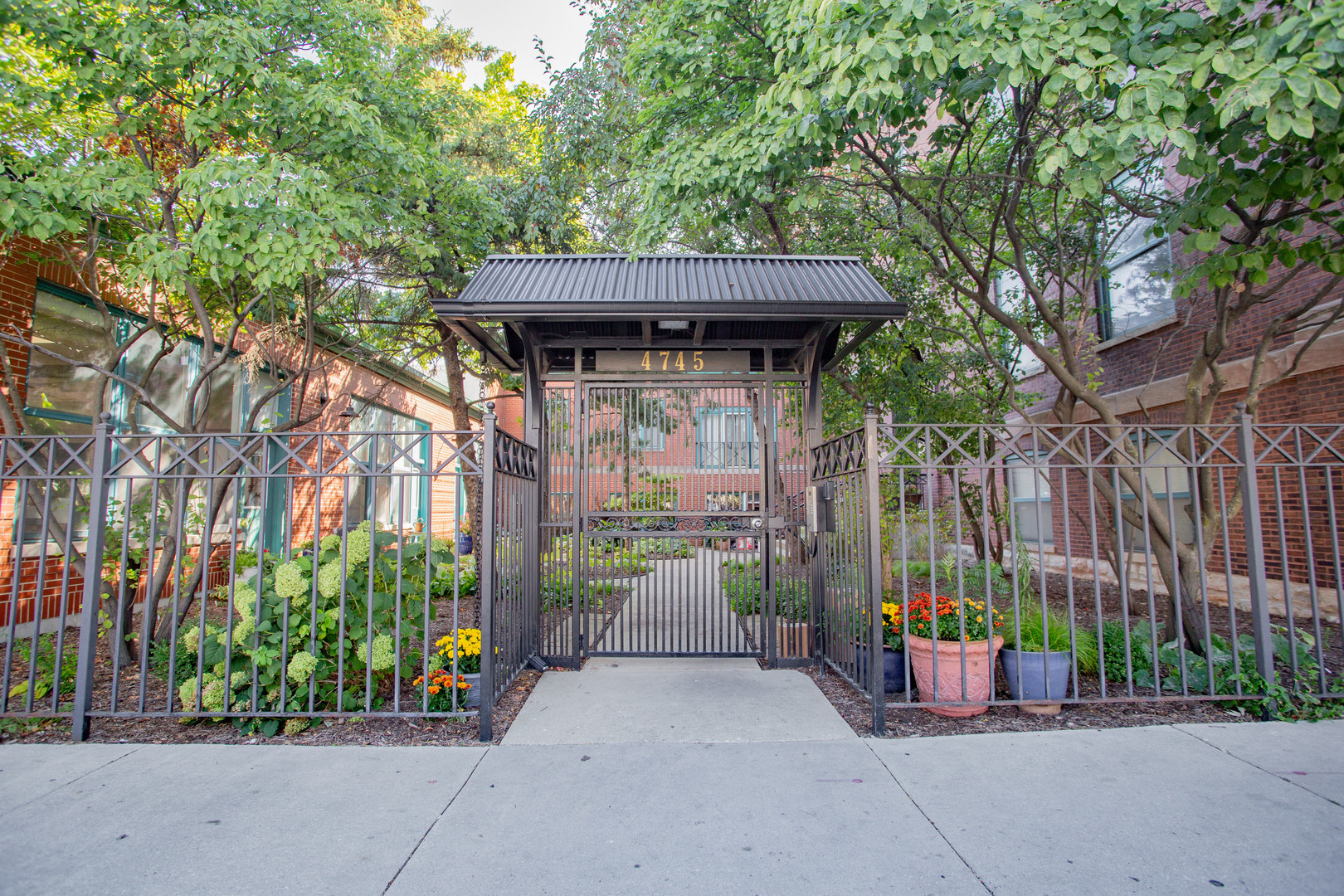 a view of a pathway with a barbeque