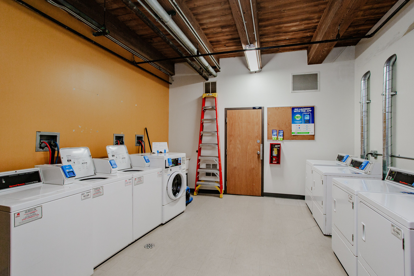4745 North Ravenswood Avenue, Unit 210 Chicago, IL 60640 - Photo 15 of 23 a utility room with dryer and washer