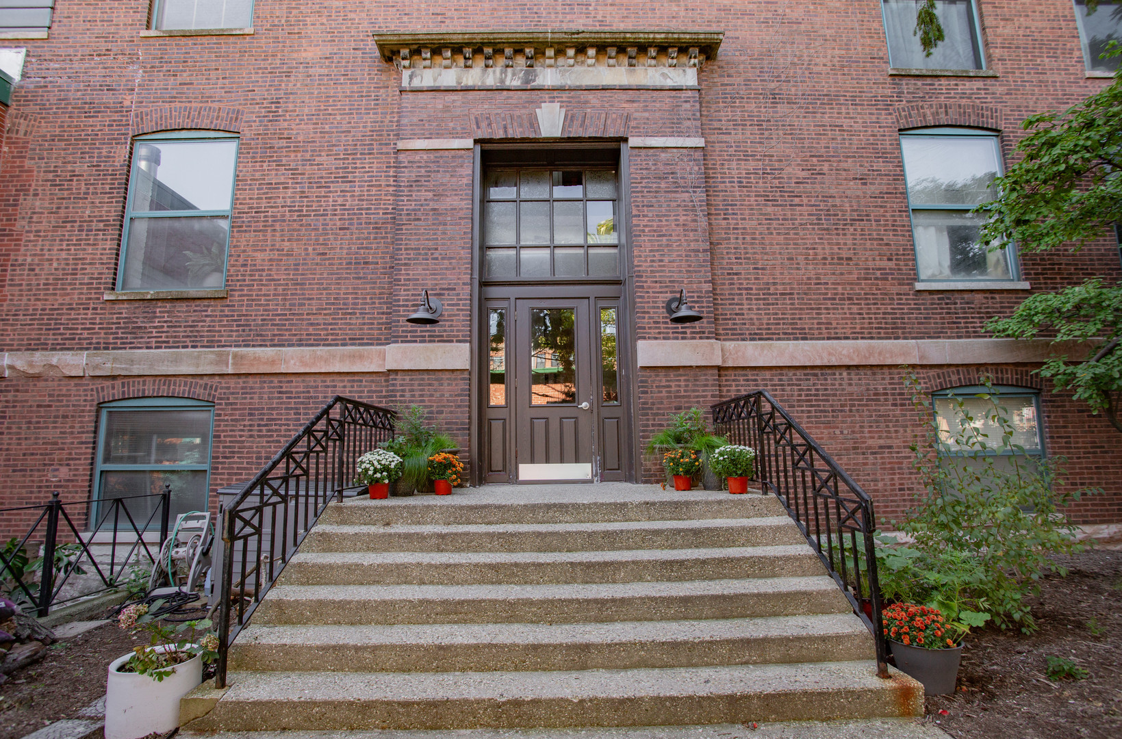 4745 North Ravenswood Avenue, Unit 210 Chicago, IL 60640 - Photo 2 of 23 a view of a building with stairs