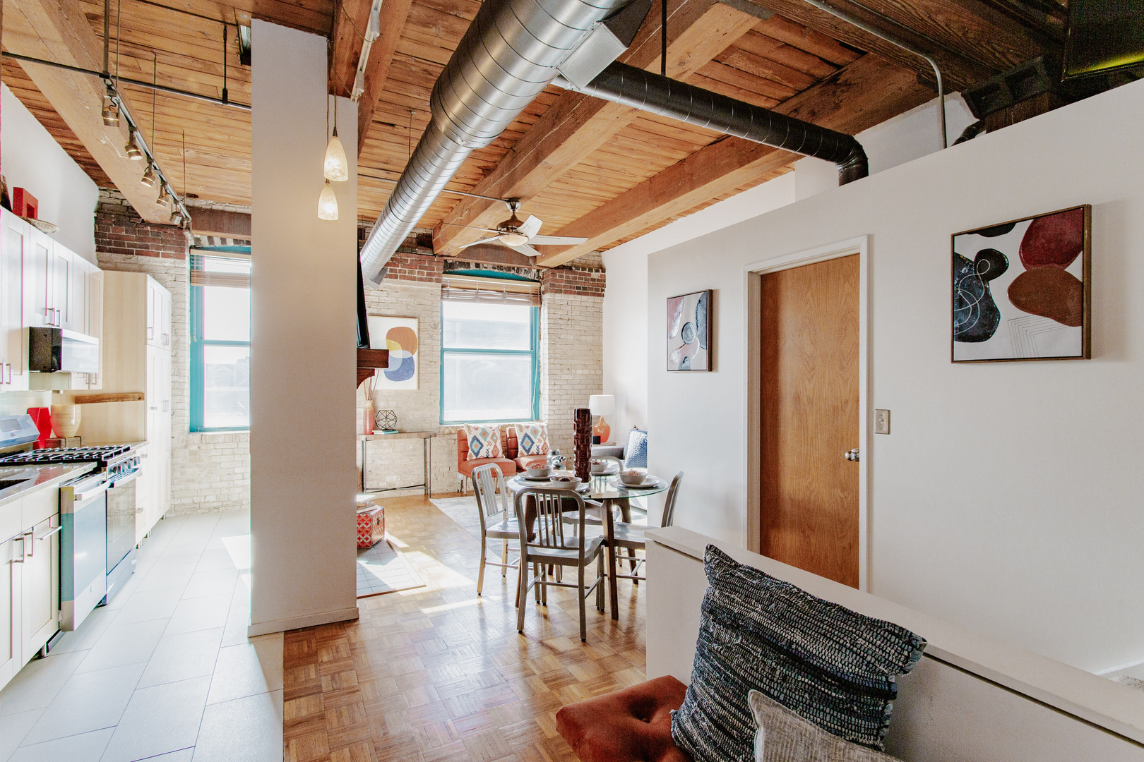 4745 North Ravenswood Avenue, Unit 210 Chicago, IL 60640 - Photo 5 of 23 a view of a dining room with furniture window and outside view