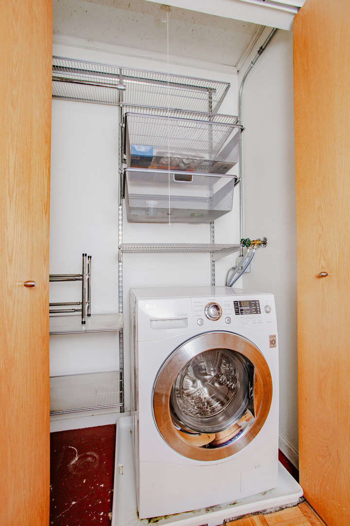 4745 North Ravenswood Avenue, Unit 210 Chicago, IL 60640 - Photo 9 of 23 a utility room with a washer and dryer