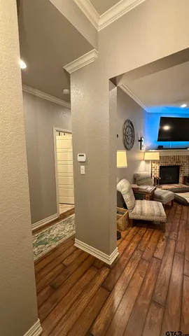 a living room with a couch and a wooden floor