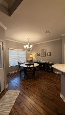 a living room with lots of furniture and a table