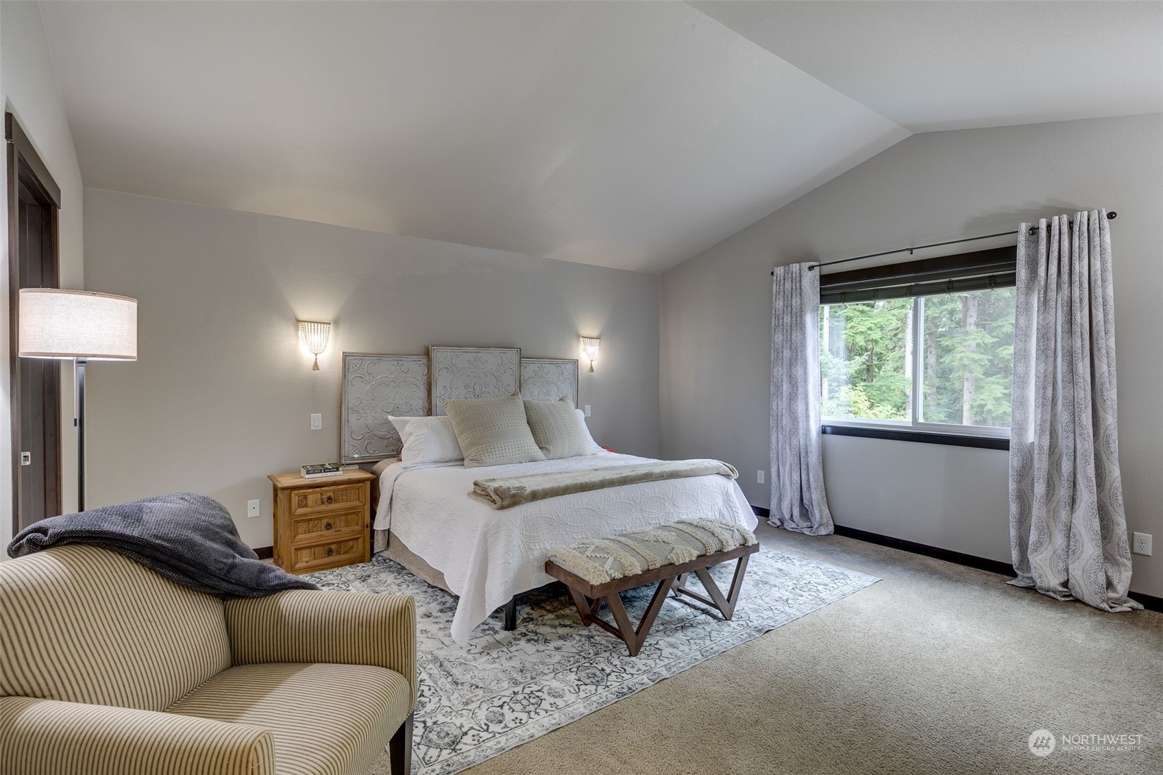 8425 Skinner Road Granite Falls, WA 98252 - Photo 23 of 40 a bed room with a bed and a couch