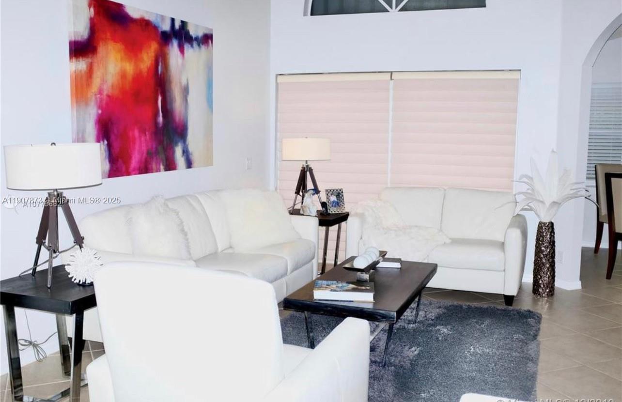 3341 Overlook Road Davie, FL 33328 - Photo 11 of 30 a living room with furniture and a window