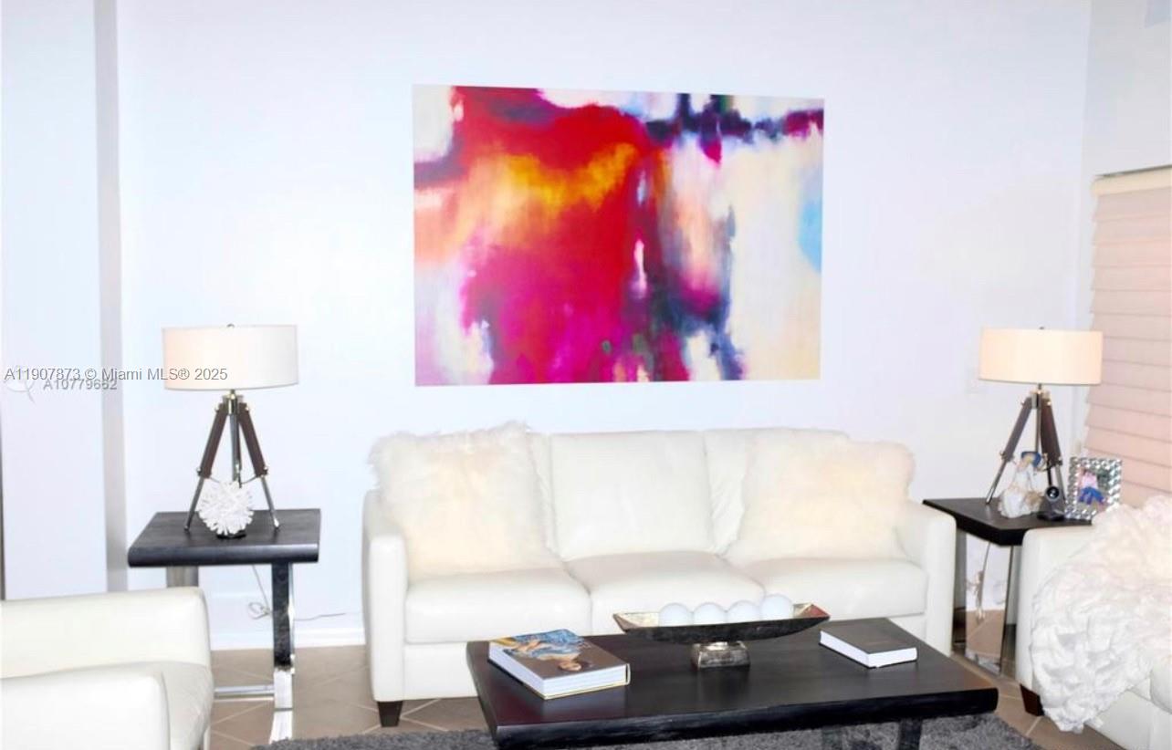 3341 Overlook Road Davie, FL 33328 - Photo 12 of 30 a living room with furniture and a lamp