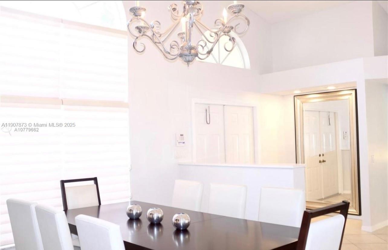 3341 Overlook Road Davie, FL 33328 - Photo 15 of 30 a bathroom with a bathtub and a window