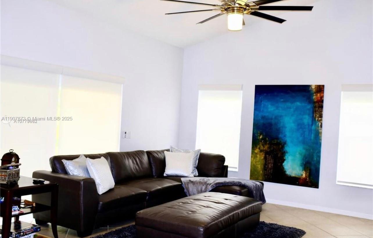 3341 Overlook Road Davie, FL 33328 - Photo 17 of 30 a living room with furniture and a window