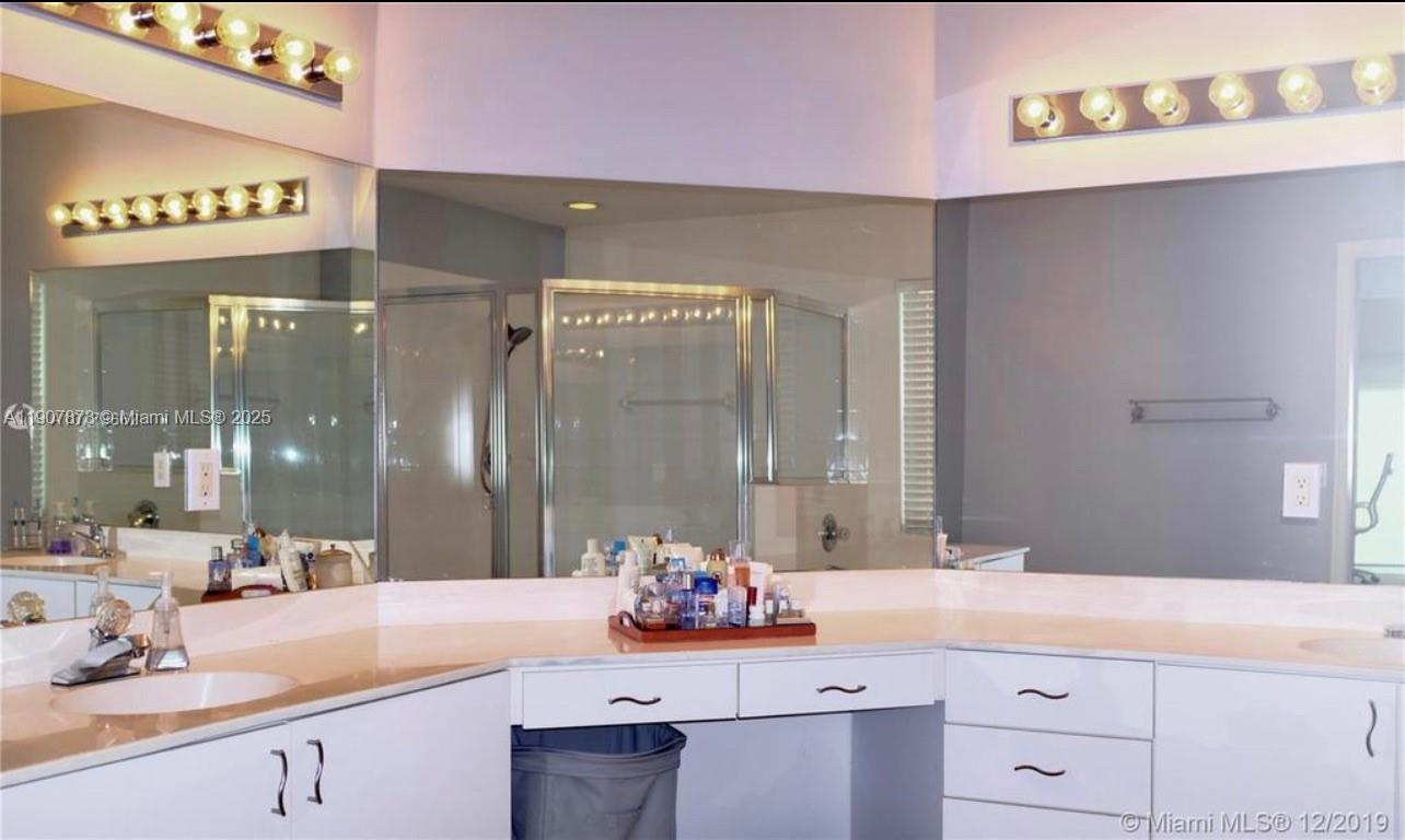 3341 Overlook Road Davie, FL 33328 - Photo 21 of 30 a bathroom with a sink vanity granite and a mirror