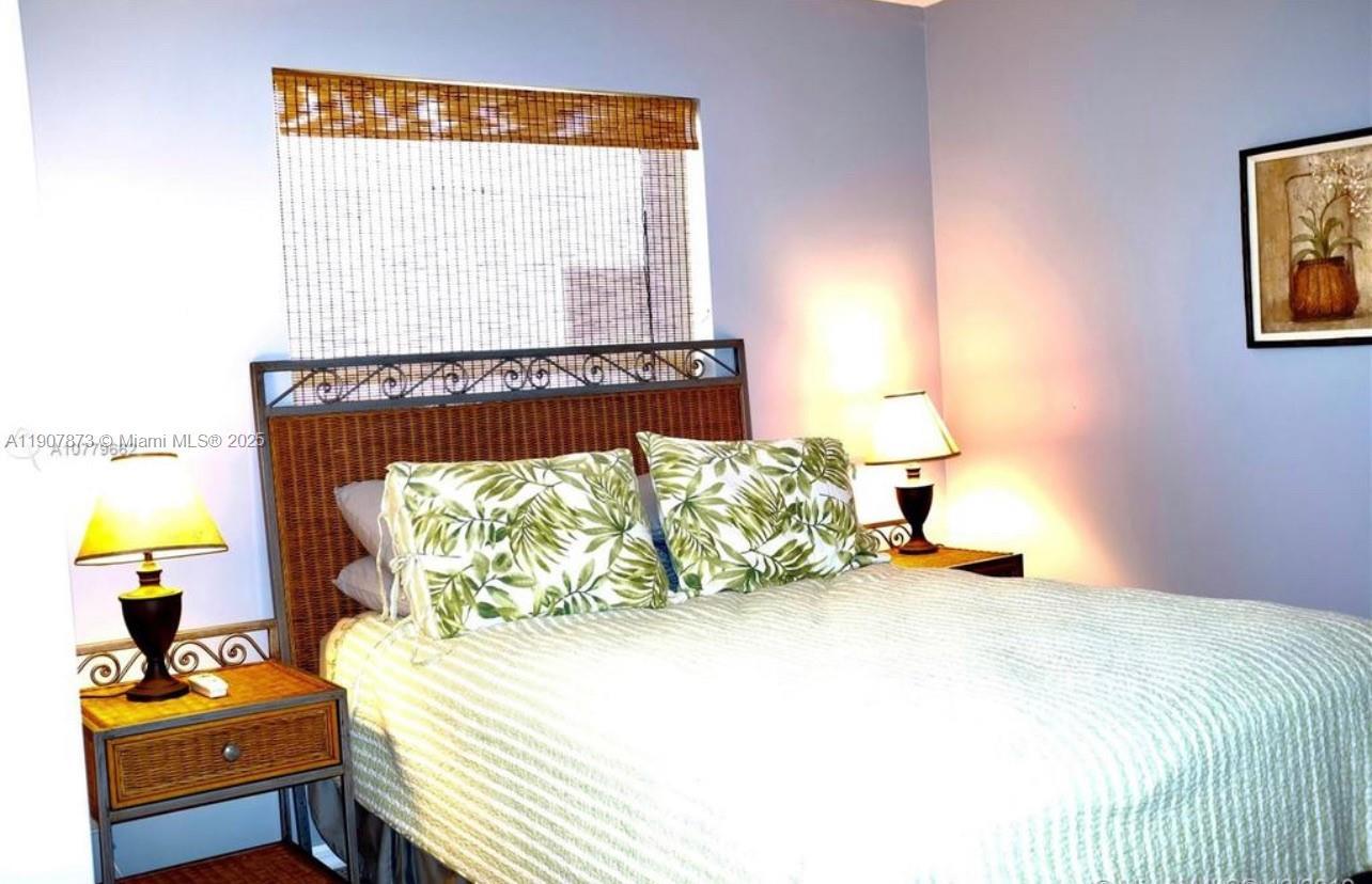 3341 Overlook Road Davie, FL 33328 - Photo 25 of 30 a bedroom with a bed and a window