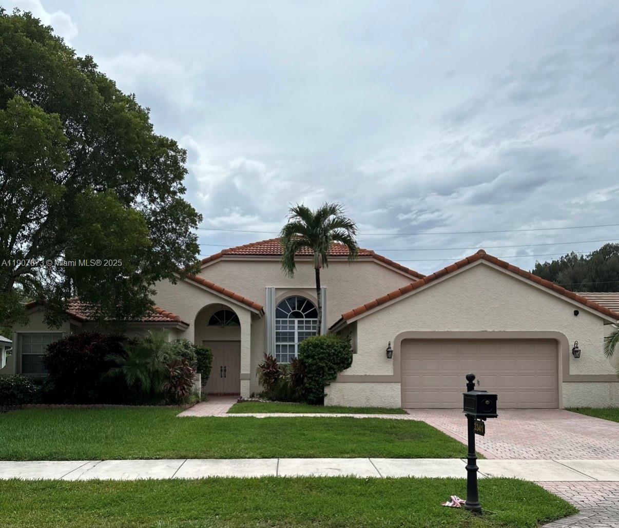 3341 Overlook Road Davie, FL 33328 - Photo 28 of 30 a front view of house with yard and green space