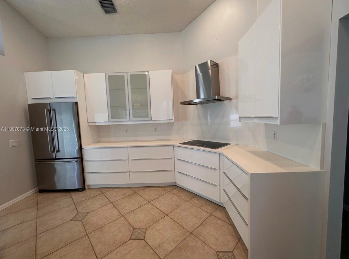 3341 Overlook Road Davie, FL 33328 - Photo 3 of 30 a kitchen with a sink cabinets and stainless steel appliances