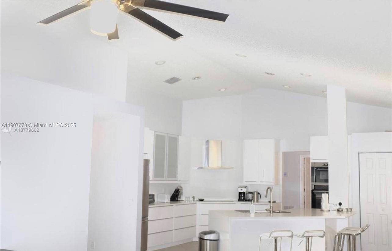 3341 Overlook Road Davie, FL 33328 - Photo 5 of 30 a bathroom with a sink and a mirror