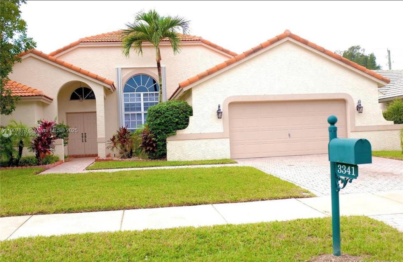 3341 Overlook Road Davie, FL 33328 - Photo 8 of 30 a front view of a house with a yard