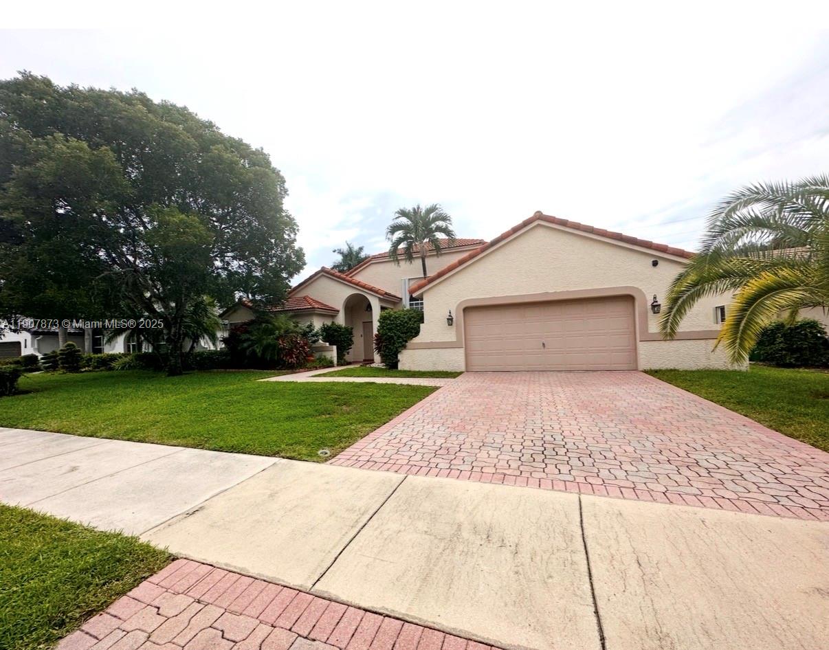 3341 Overlook Road Davie, FL 33328 - Photo 10 of 30 a front view of a house with a yard
