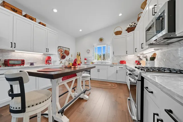 a view of a dining room with furniture and a livingroom