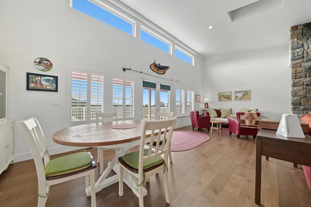 a living room with furniture wooden floor and a fireplace