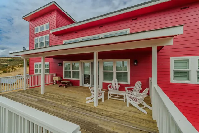a open kitchen with stainless steel appliances granite countertop a stove and a refrigerator