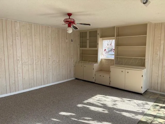 a view of a livingroom with furniture and cabinet
