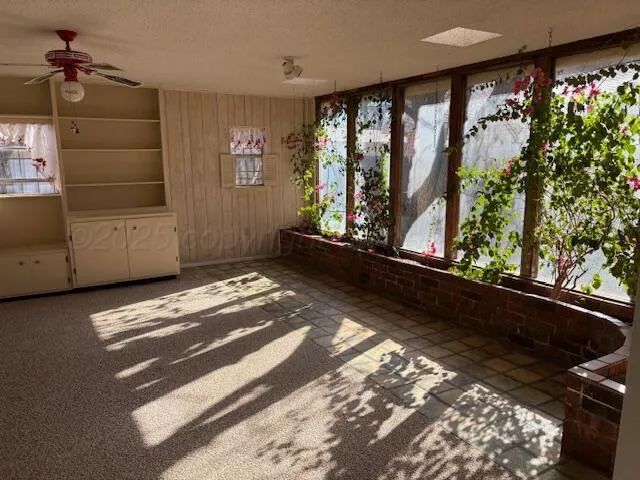 a view of room with stairs and furniture