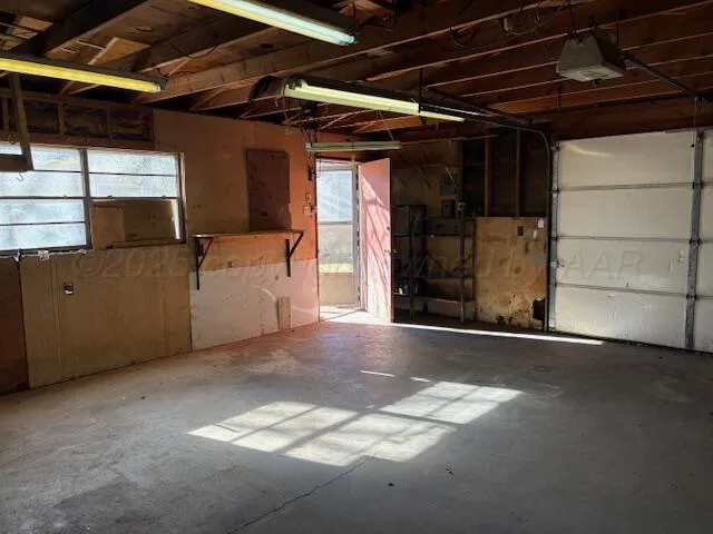 a view of empty room with wooden walls