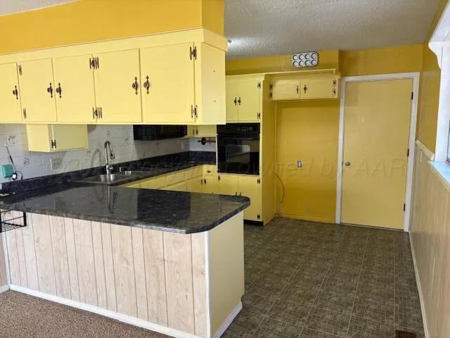 a view of a kitchen with a sink