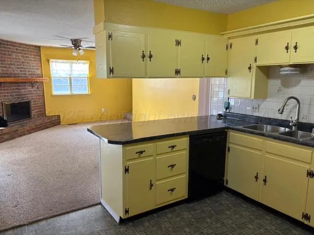 a kitchen with stainless steel appliances a sink a stove and a refrigerator