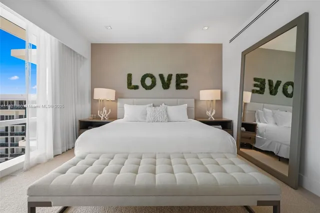 a bedroom with a bed and a night stand