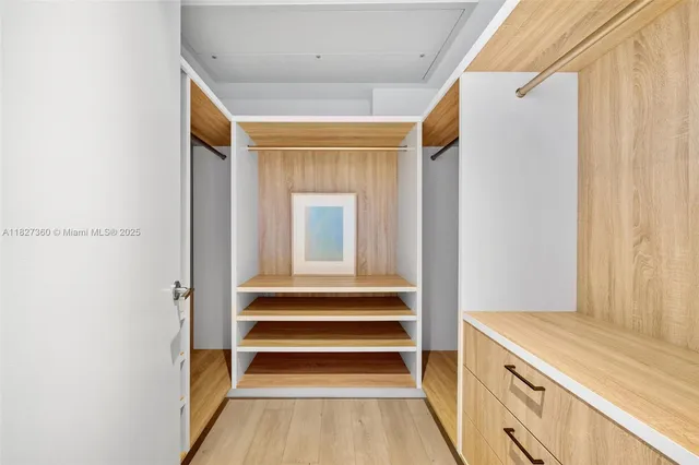 a bathroom with a sink toilet vanity and shower