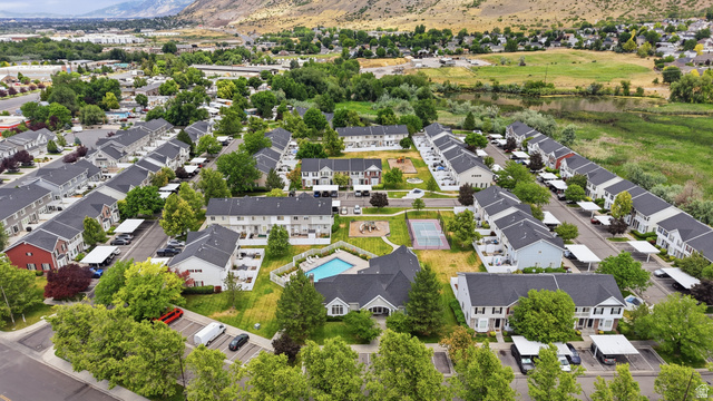 793 North 150 E Street Springville, UT 84663 - Photo 26 of 26 Aerial overview of a multi-unit residential community featuring a central swimming pool, tennis court, and playground