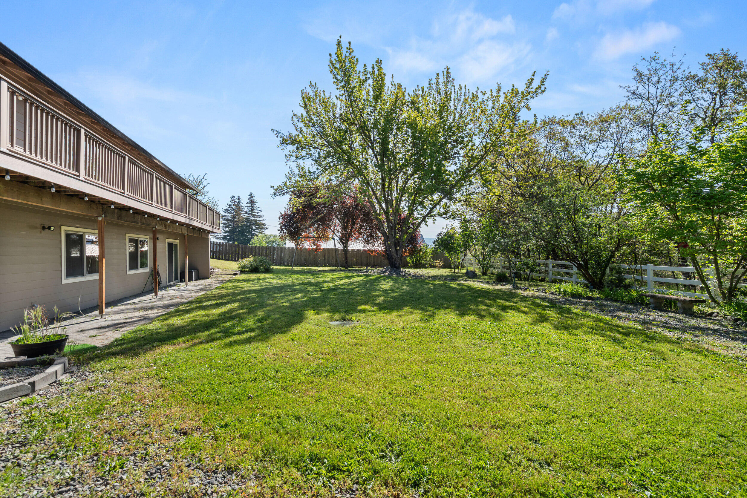 3583 Ross Lane Central Point, OR 97502 - Photo 42 of 52 a backyard of a house with lots of green space