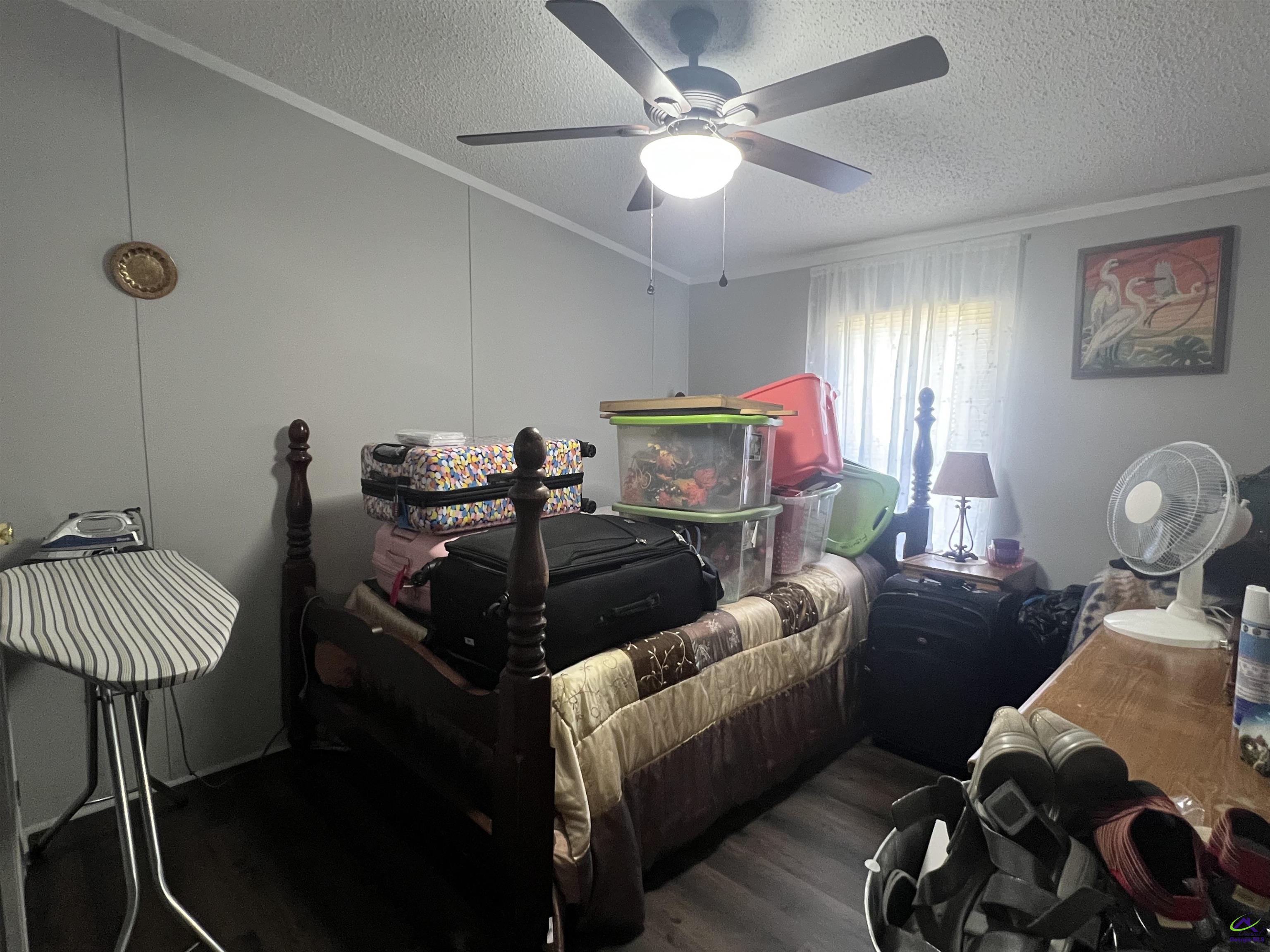 166 Pebble Hills Road Cochran, GA 31014 - Photo 25 of 27 a living room with furniture and a chandelier