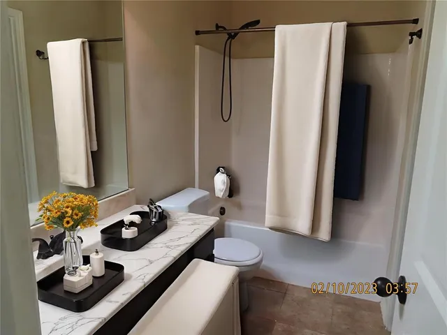 a view of a workspace with furniture