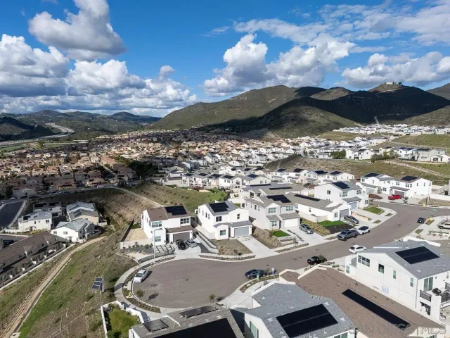 a view of a city with lot of flower plants