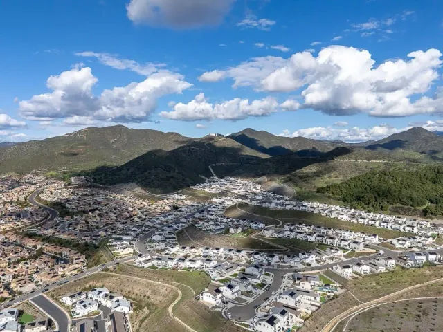 an aerial view of a house with a ocean view