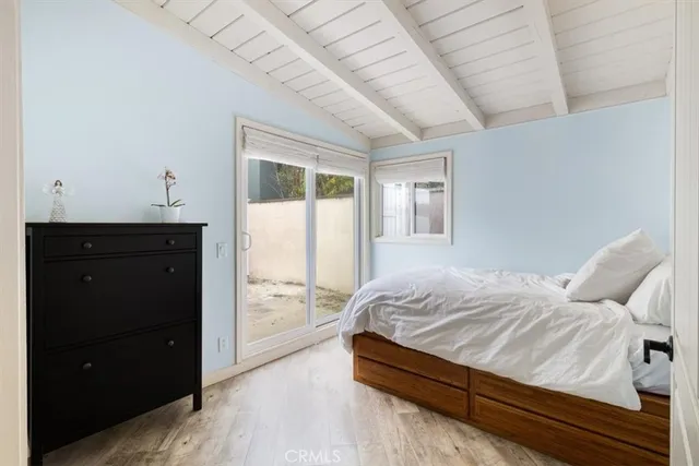 a bedroom with a bed and a view of bathroom