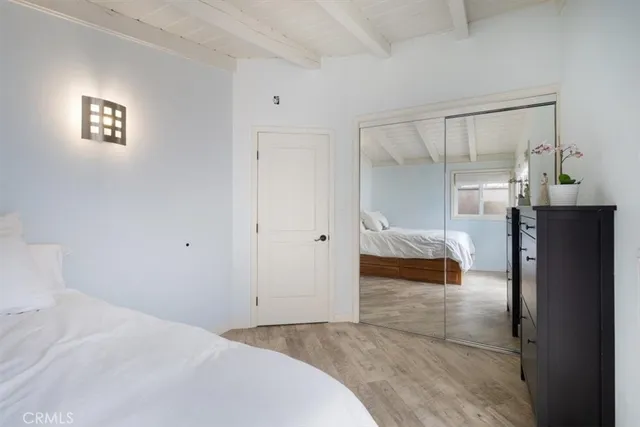 a bedroom with a bed and window