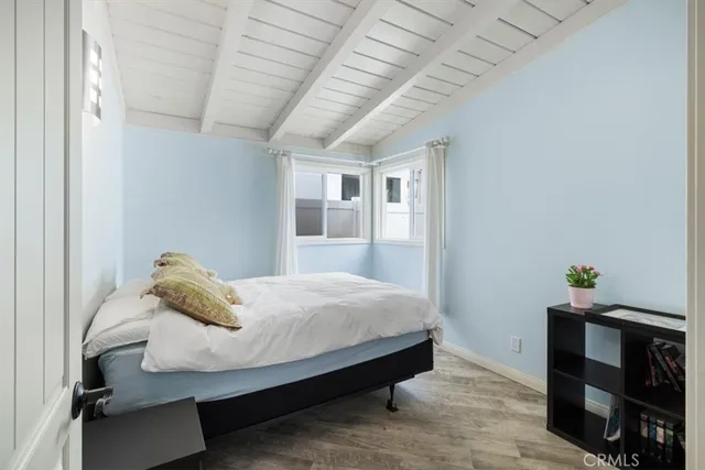 a bedroom with a bed and a chair