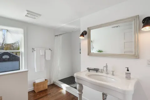 a bathroom with a sink and a mirror