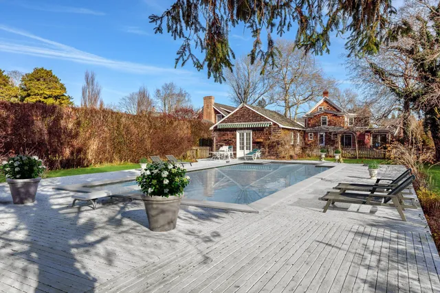 a view of a house with sitting area and a yard