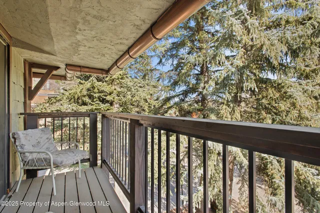 a view of balcony with furniture