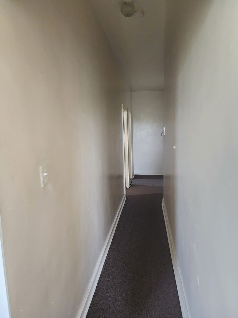 6527 South Kimbark Avenue, Unit 4F Chicago, IL 60637 - Photo 18 of 28 a view of a hallway