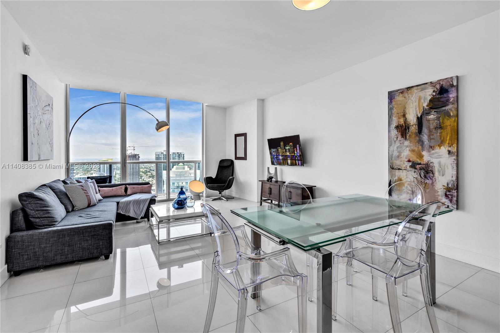Brickell Miami, FL 33131 - Photo 2 of 25 a living room with furniture and floor to ceiling window